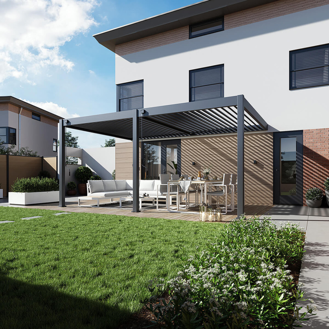 Pergola tarasowa DELUXE WALL 3.6x5.3 w kolorze antracytowym wkomponowana w przestrzeń tarasu przed nowoczesnym domem.